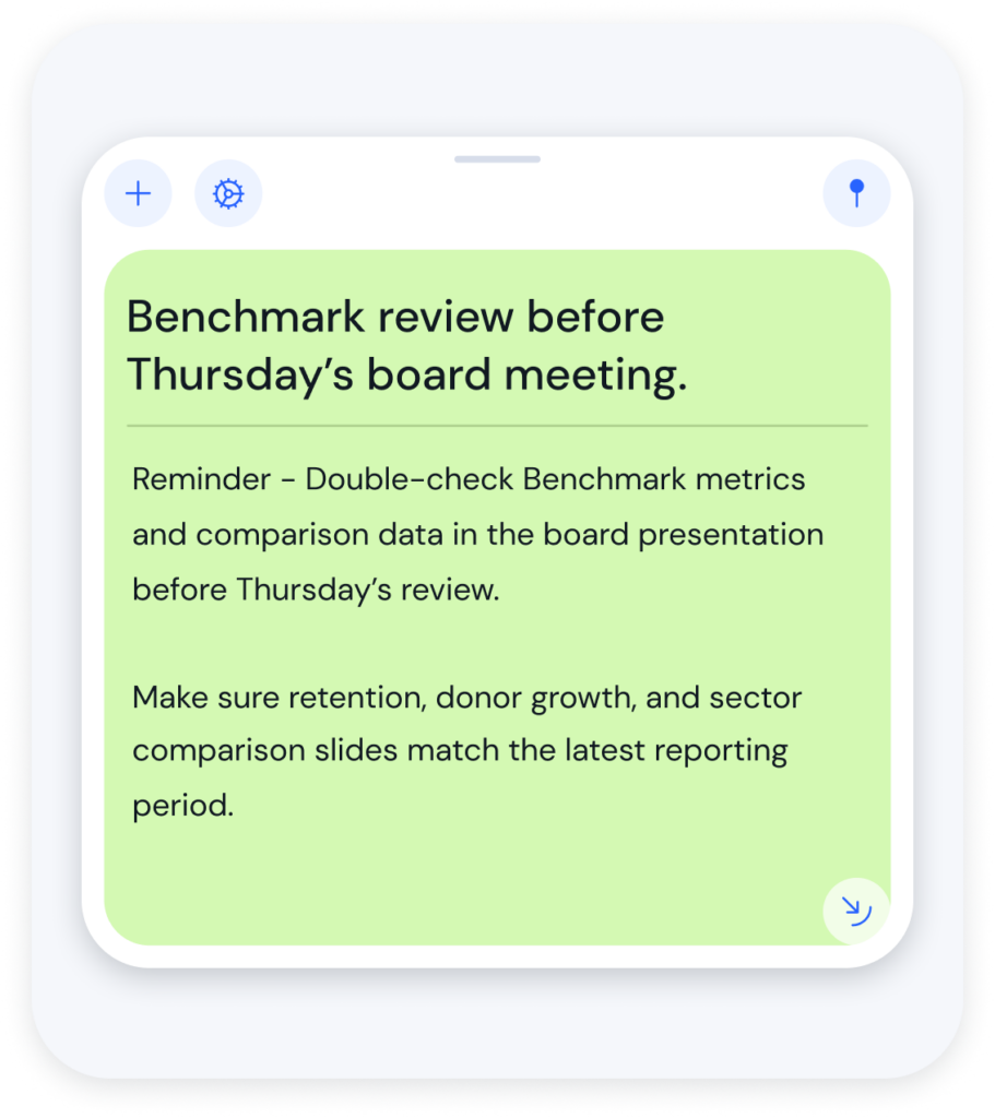 Mobile app note showing a lime-green rounded card with the heading 'Benchmark review before Thursday’s board meeting.' and reminder text about checking benchmarking metrics before the meeting.