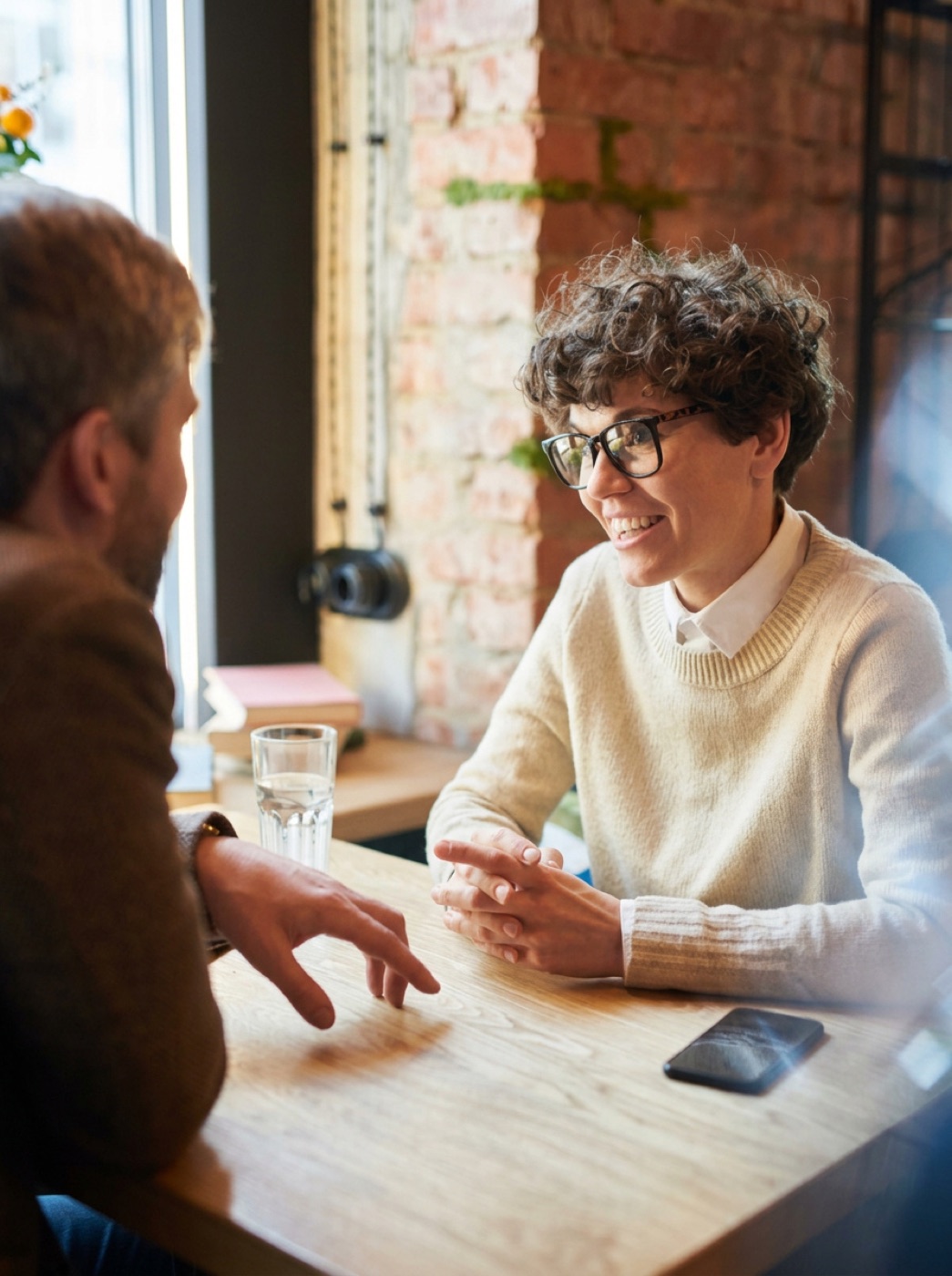 A fundraiser and a donor in an unhurried conversation over coffee.